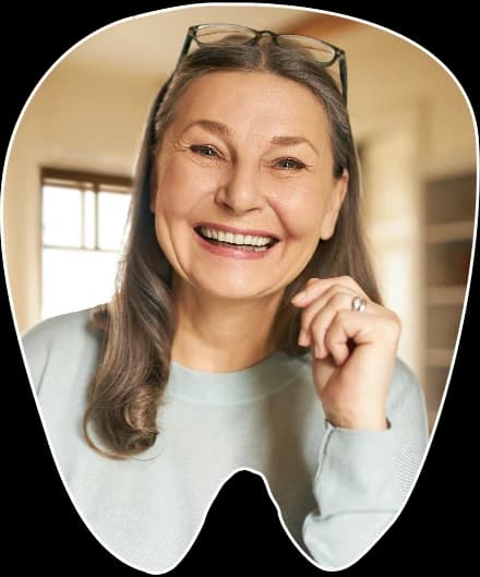 Older patient smiling confidently